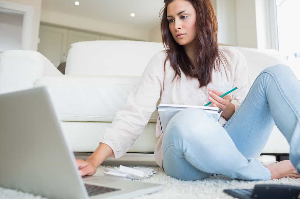 Woman learning about financial aid on a laptop