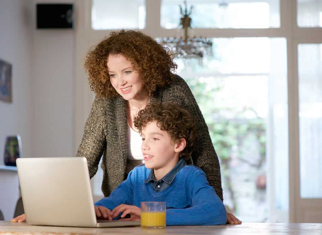 Mother and son using computer