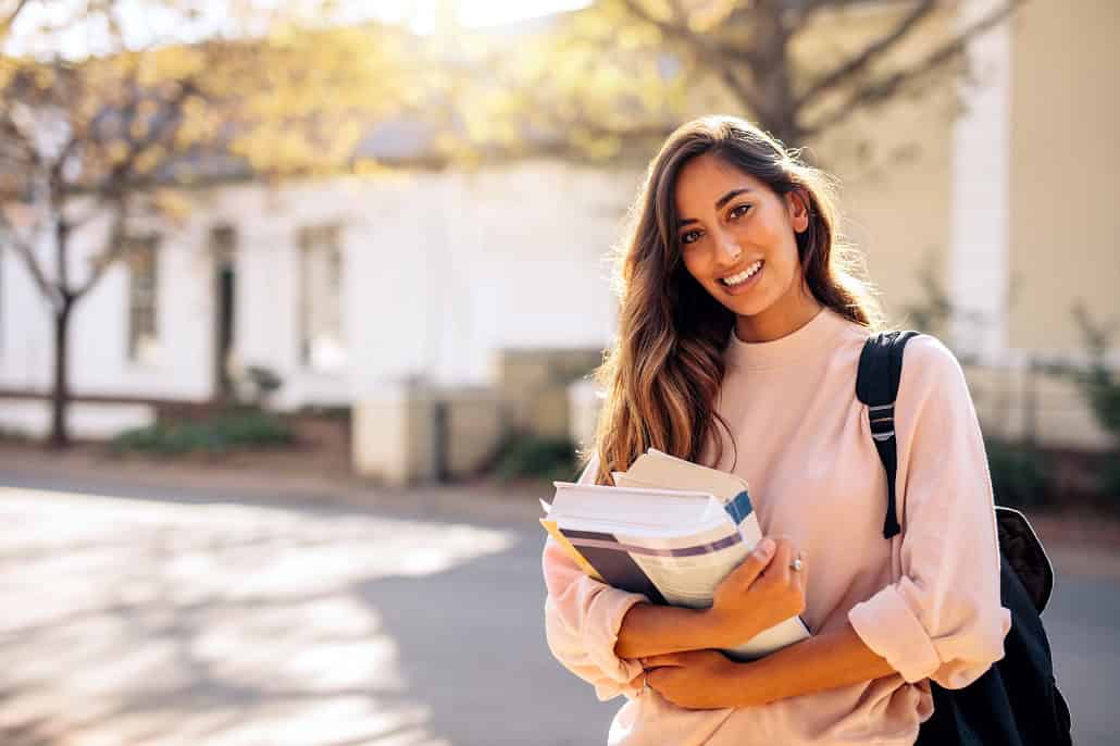 Student holding books