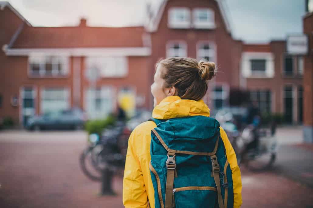 Student with backpack on campus