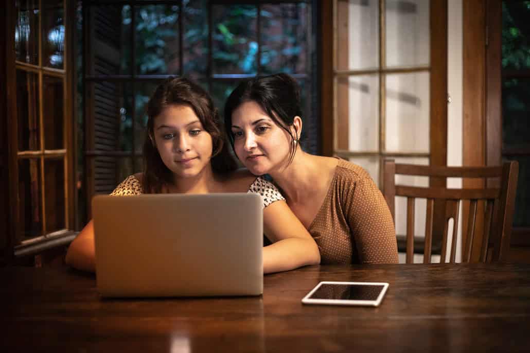 Mother and daughter using laptop to complete the FAFSA