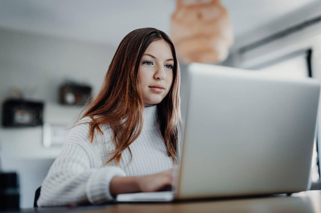 Girl on laptop looking for scholarships