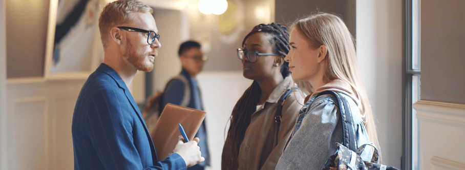 Professor talking to 2 students