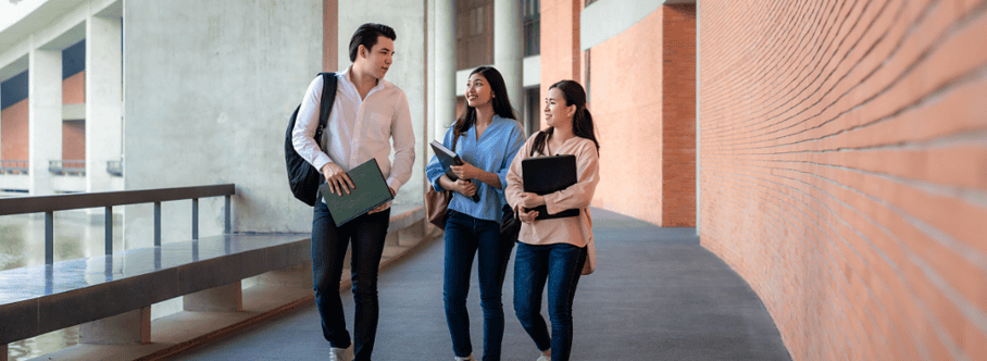 3 students walking and talking