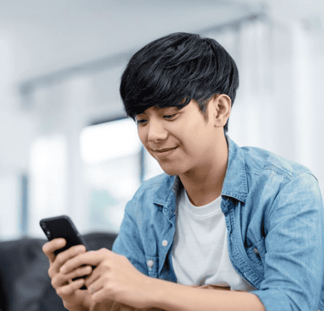 Student looking at his phone